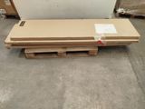 two pallets of wood sit on pallets in a warehouse