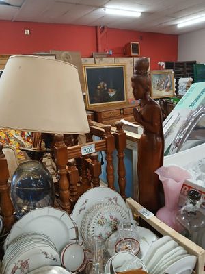 a lot of dishes and plates in a store
