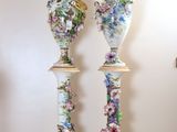 two vases that are sitting on a table