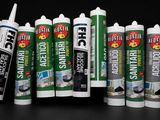 several different types of construction adhesives are lined up against a black background