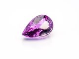 a purple amethe gems on a white background