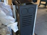 an image of a tv sitting on a stand in a warehouse