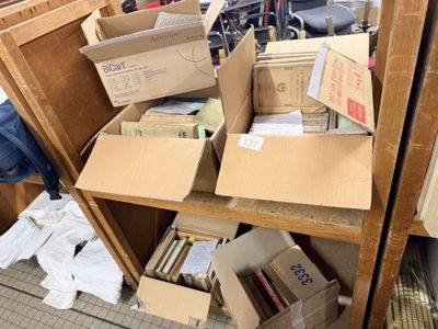 many boxes on a shelf in a room