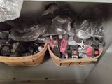 two baskets of tools sitting on a shelf in a room