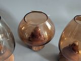 three vases that are sitting on a table
