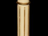 a tall candle that is sitting on top of a table