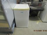 a refrigerator and a washing machine in a room
