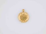 an image of a gold locke with a leaf design on it