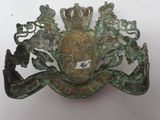 a metal plaque with a crown on top of it