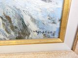 a picture of a painting on the wall of a bathroom