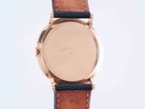 an image of a close up of a watch on a white surface