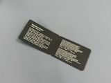 two black and white business cards sitting on top of a table