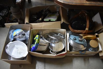 two boxes with pots and pans in them on the floor
