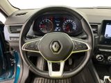 the interior of a car with a steering wheel and dashboard controls