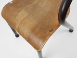 a wooden chair with metal legs on a white surface