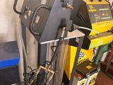 a machine that is sitting on a stand in a garage