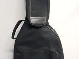 a guitar case sitting on the floor next to a wall