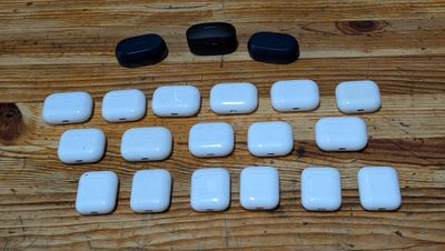 a lot of white and black buttons on a wooden table