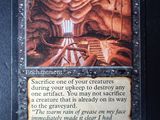 a close up of a card with a picture of a cave in the background