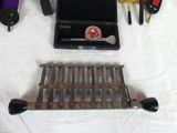 many tools that are laying out on a table