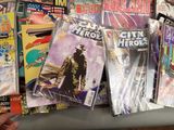 many comic books on a shelf in a store