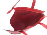 the inside of a red handbag with a zipper on it