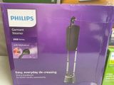 purple box of philips speakers on a table in a store