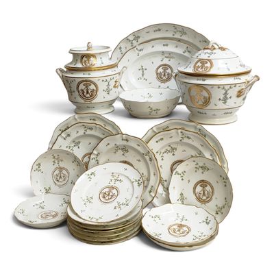 many plates and bowls that are sitting on a table