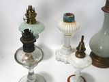 many different types of glass vases on the table