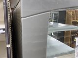 a refrigerator that is sitting in the middle of a store
