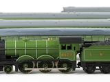 a lot of toy trains that are sitting on a table