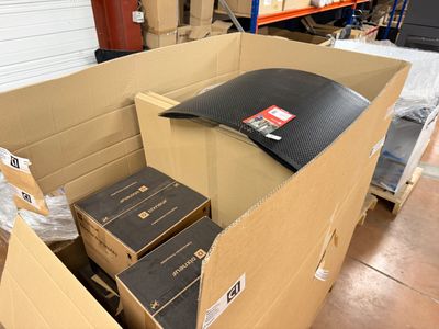 a cardboard box filled with boxes and boxes on the floor