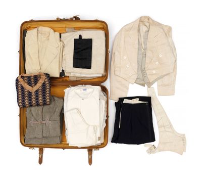 a suit case filled with clothes and a jacket