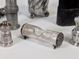 a lot of silver items that are sitting on a table