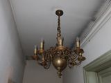a chandelier hanging from the ceiling in a hallway
