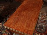a wooden desk with a drawer on top of it