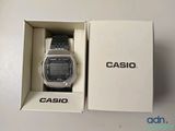 a close up of a casio watch in a box on a table