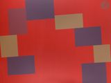 un sac rouge à carreaux posé sur une table
