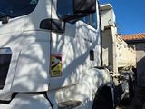 a white truck that is parked on the side of the road