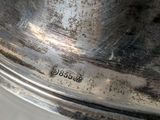 a close up of a silver plate on a window sill