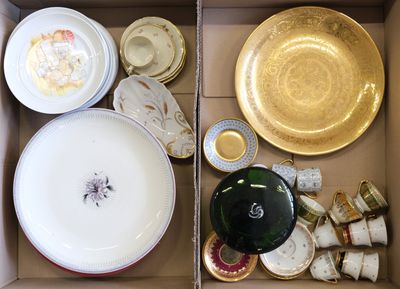 many plates and bowls in a box on the table