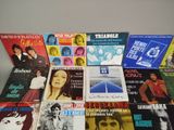 several different album covers are stacked on top of each other