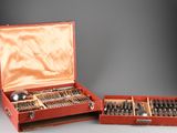 a red case with silverware in it on a table