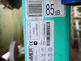 a close up of a green pipe with a barcode on it