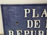 a blue sign that says place de la republic on the wall