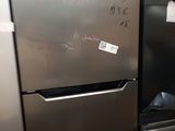 a stainless steel refrigerator with a price tag on it