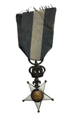 une image représentant une médaille ornée d'une étoile sur le recto