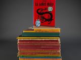 books stacked on top of each other on a gray surface