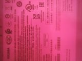 the back of a pink box with a pink label on it
