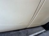 a close up of a car door with the door handle missing